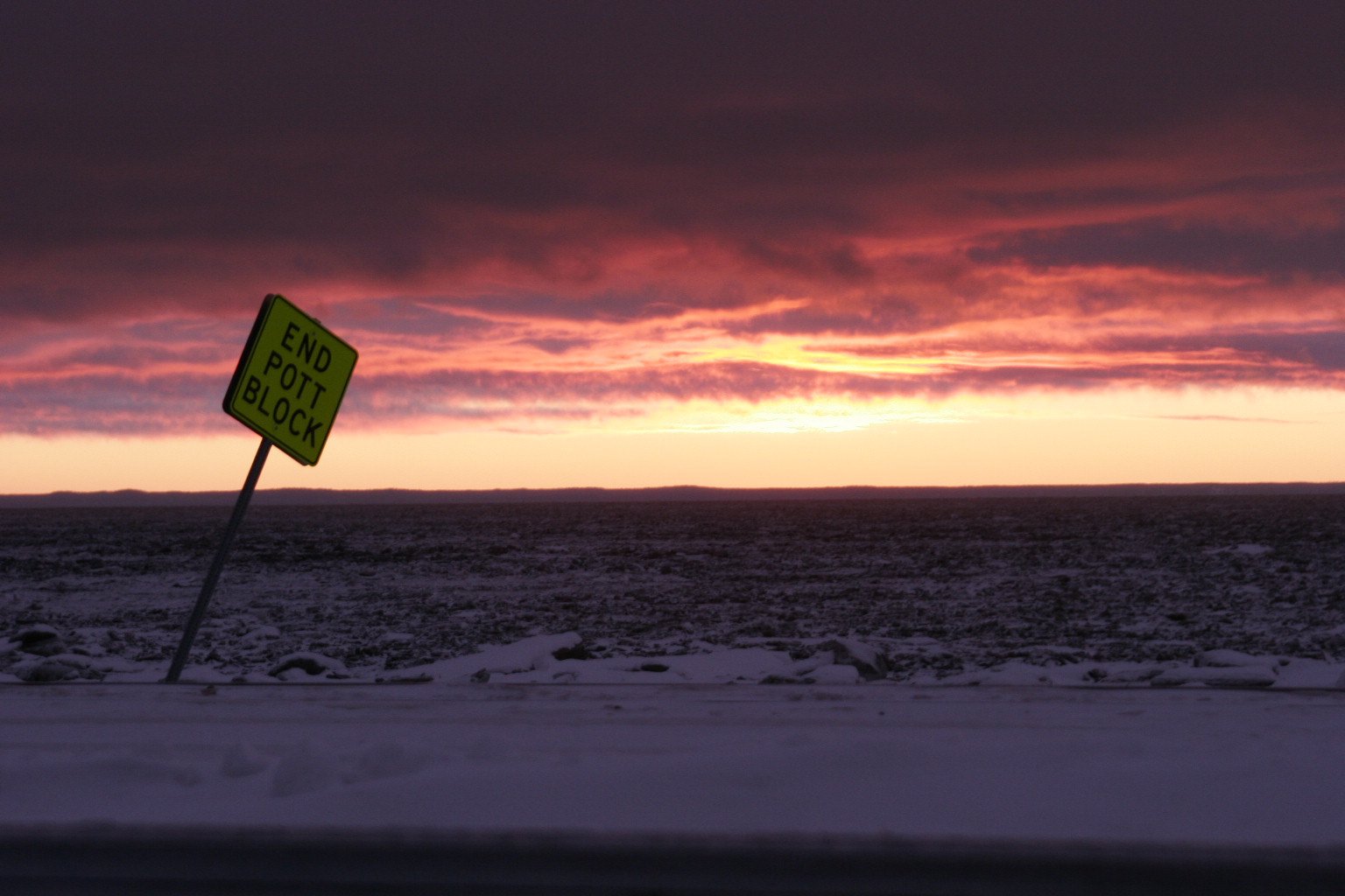 Sunset over a snowy Alaska plain